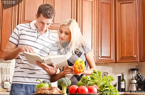 Image of Young Couple Cooking