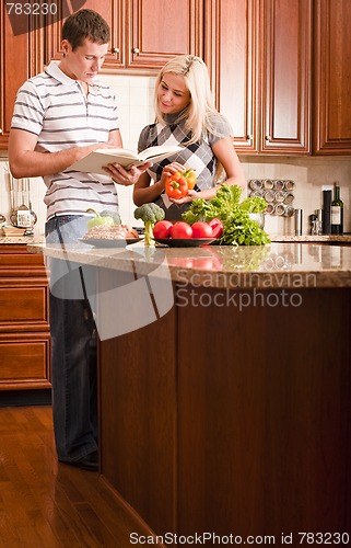 Image of Young Couple Cooking