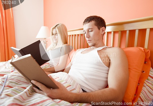 Image of Couple Reading in Bed