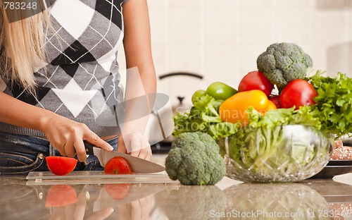 Image of Woman Cutting Tomato