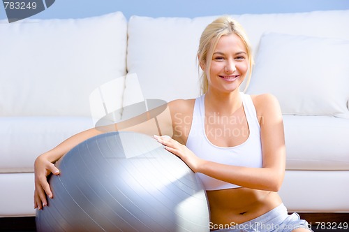 Image of Young Woman with Exercise Ball