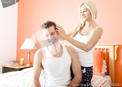 Image of Affectionate Couple in Bedroom