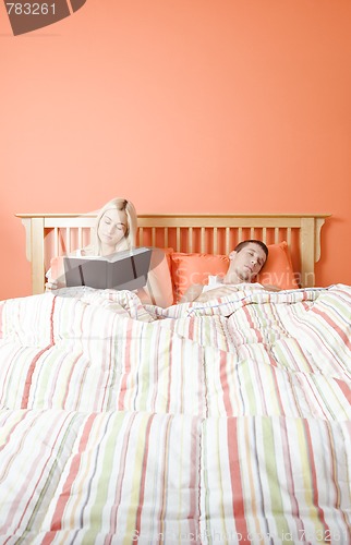 Image of Couple Relaxing in Bed