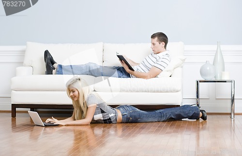 Image of Couple Relaxing in Living Room