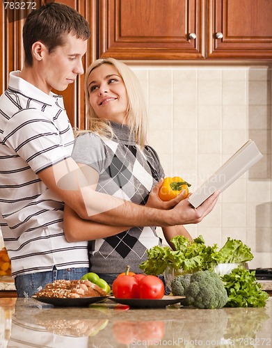 Image of Young Couple Cooking