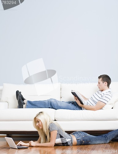 Image of Couple Relaxing in Living Room