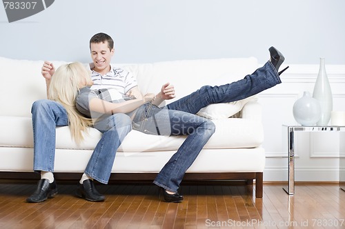 Image of Affectionate Couple Relaxing Together on Couch