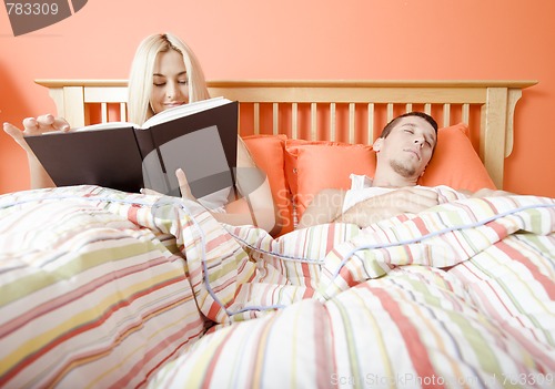 Image of Couple Relaxing in Bed