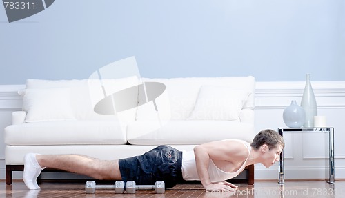 Image of Man Doing Push-ups in Living Room