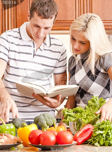 Image of Young Couple Cooking