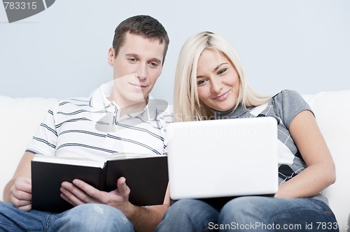 Image of Couple Relaxing on Couch