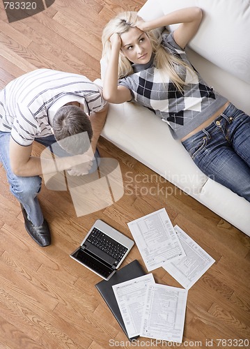 Image of Young Couple Doing Taxes
