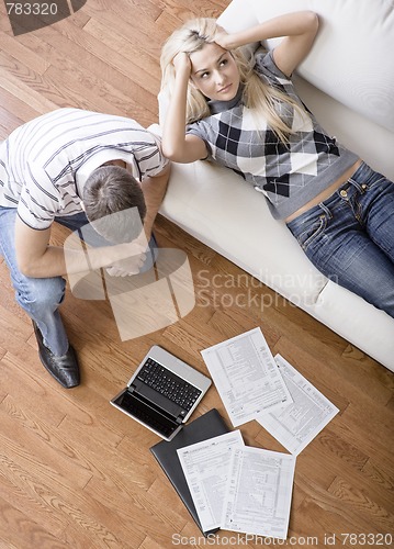 Image of Young Couple Doing Taxes