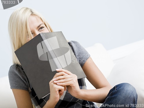 Image of Laughing Woman Holding a Book