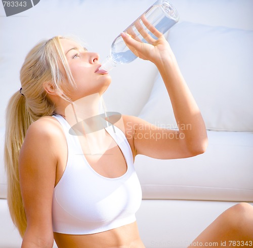 Image of Young Woman Drinking Bottled Water