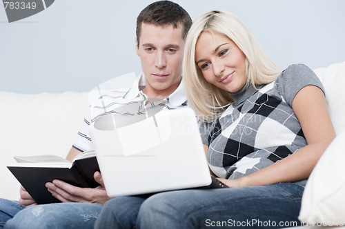 Image of Couple Relaxing on Couch