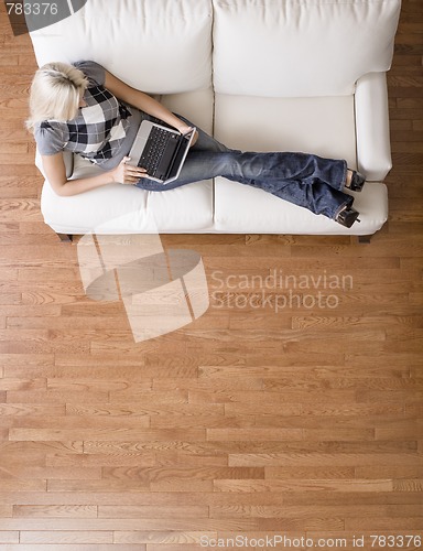 Image of Overhead View of Woman on Couch With Laptop