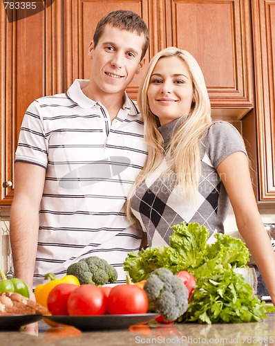 Image of Young Couple Posing in Kitchen