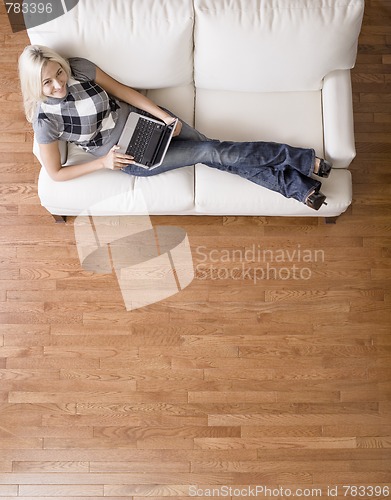 Image of Overhead View of Woman on Couch With Laptop