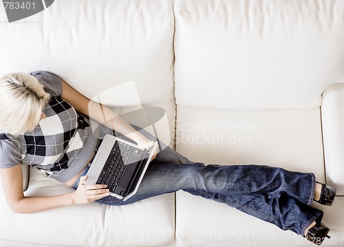 Image of Overhead View of Woman on Couch With Laptop