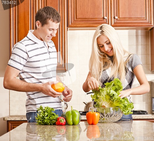 Image of Young Couple Making Salad