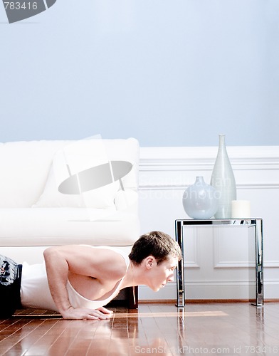 Image of Man Doing Push-ups in Living Room