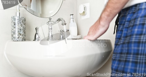 Image of Sink with Water Running From Faucet