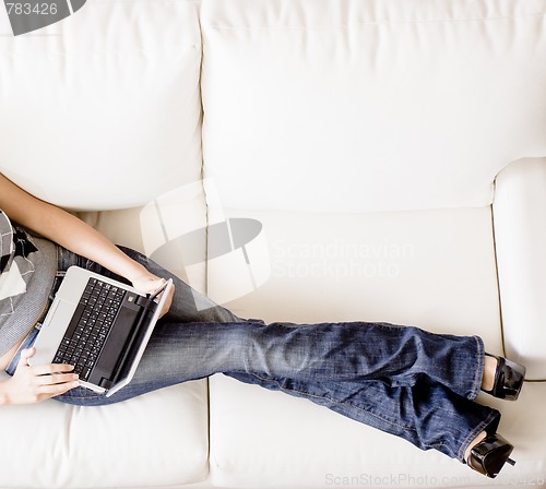 Image of Overhead View of Woman on Couch With Laptop