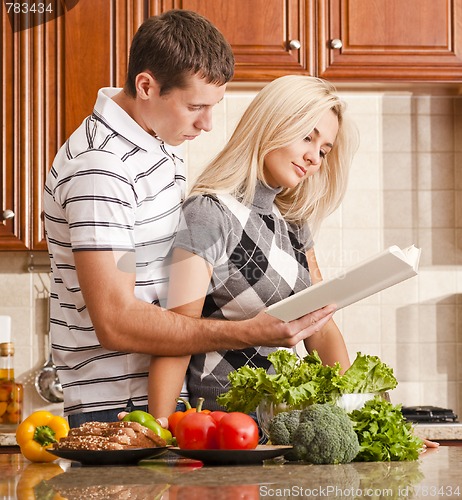 Image of Young Couple Cooking