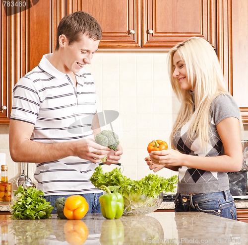 Image of Young Couple Making Salad