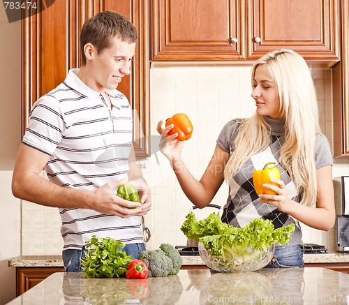 Image of Young Couple Making Salad