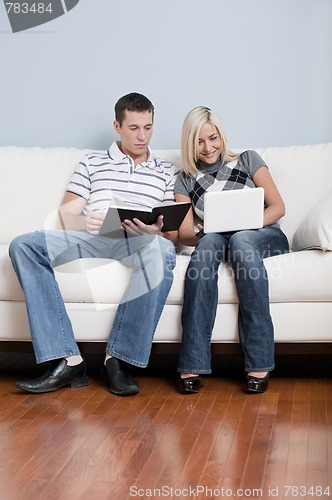 Image of Couple Relaxing on Couch