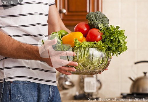 Image of Man Holding Bowl of Vegetables