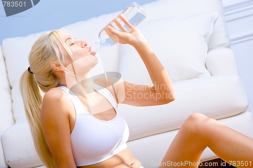 Image of Young Woman Drinking Bottled Water