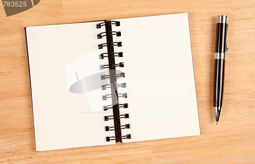 Image of Blank Spiral Note Pad and Pen on Wood