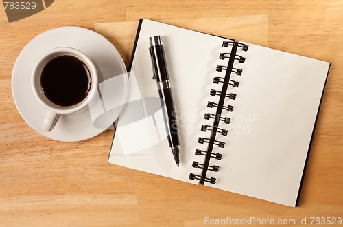 Image of Blank Spiral Note Pad, Cup and Pen on Wood