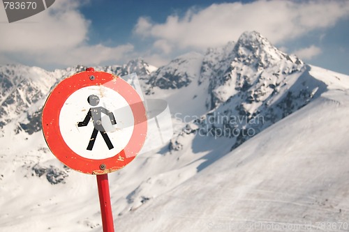 Image of Warning sign in snowy mountains