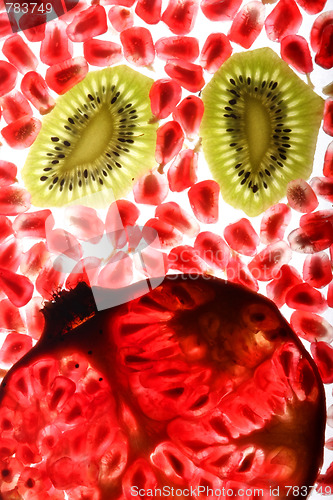 Image of beautiful and fresh pomegranate grains and kiwi