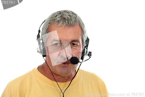 Image of mature man in a business call center