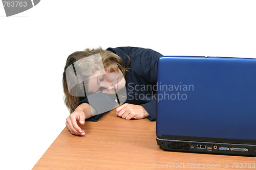 Image of young woman dreaming on laptop