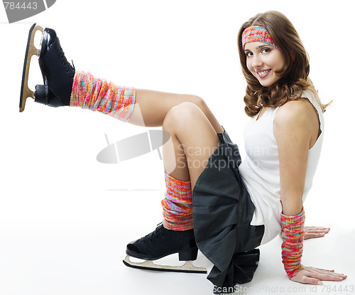 Image of Woman in ice skates smile