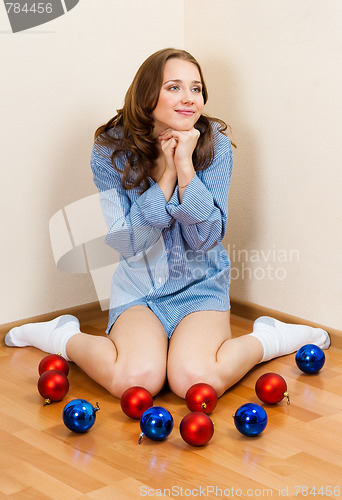 Image of Lovely young woman wait for christmass