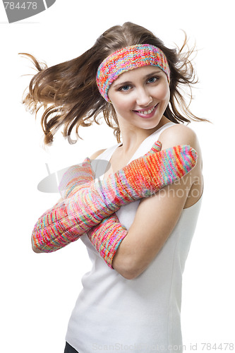 Image of Woman smile standing in color wool gloves