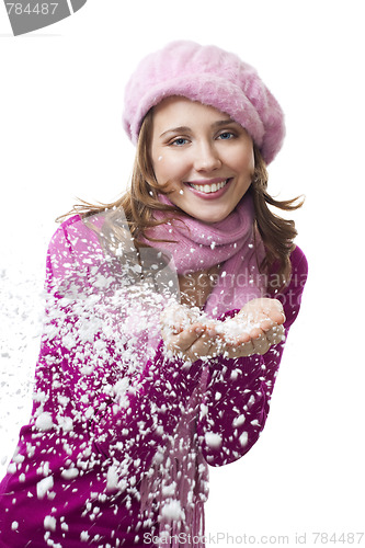 Image of Woman blow snowflakes from hands