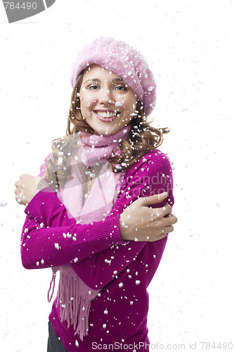 Image of Woman smile while snowflakes fall