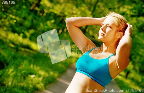 Image of Young Woman Working Out