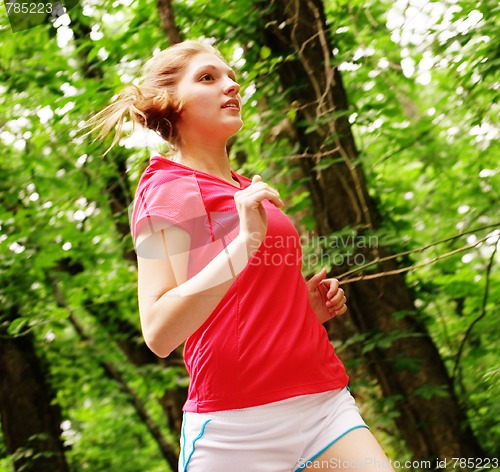 Image of Woman In Red Running