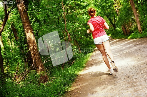 Image of Woman In Red Running