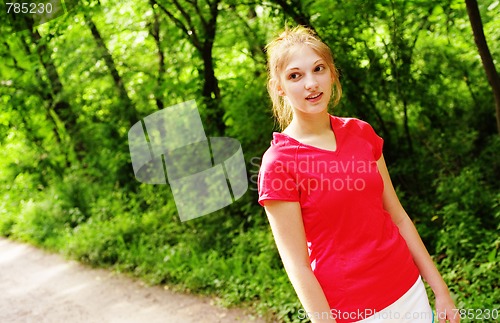 Image of Woman In Red Running