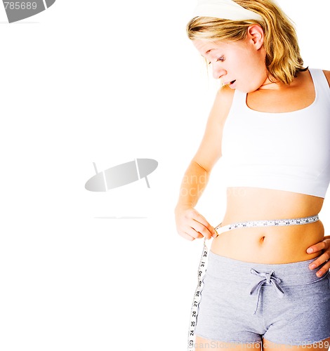 Image of Young Woman Measuring Herself On White